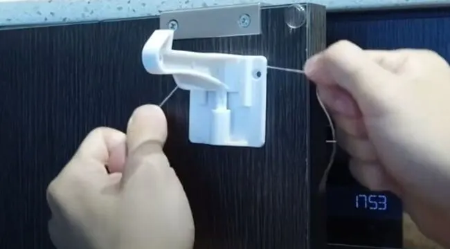 removing a child-proof lock using dental floss