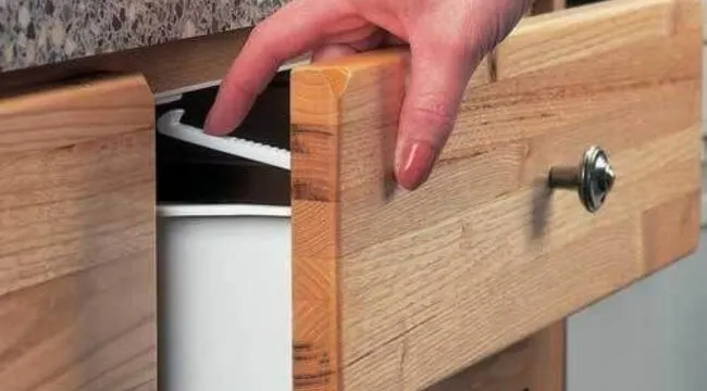 how to remove a child-proof lock on a kitchen cabinet