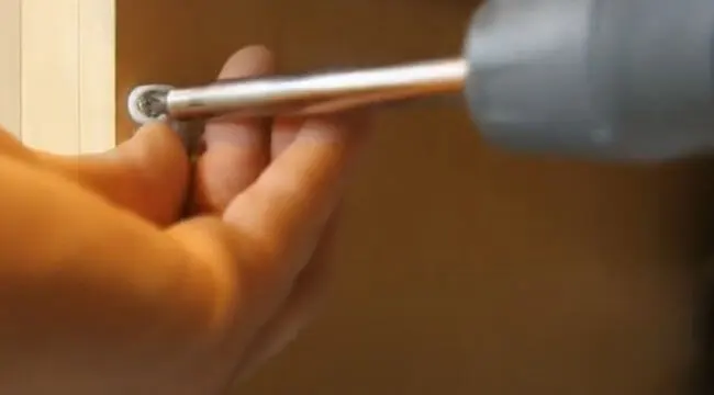 how to remove a child-proof lock using a screw driver 