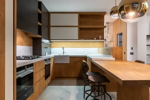 a stylish kitchen with white and brown combination