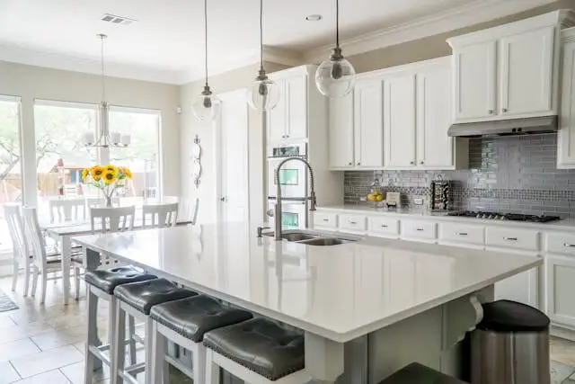 a stylish white gourmet kitchen