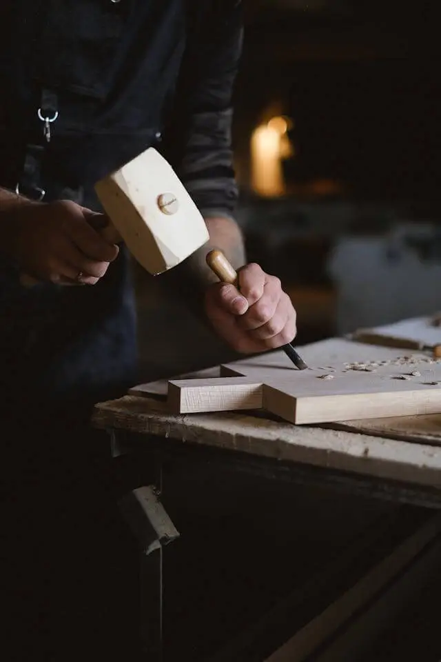 a cabinet maker finishing wood